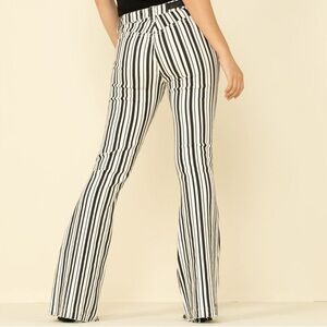New never worn rock and roll black and white flare jeans!